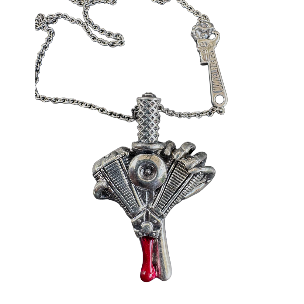 Heart of Power v-twin heart-and-dagger pendant by Monkey Wrench Designs, shown on its chain