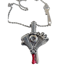 Heart of Power v-twin heart-and-dagger pendant by Monkey Wrench Designs, shown on its chain
